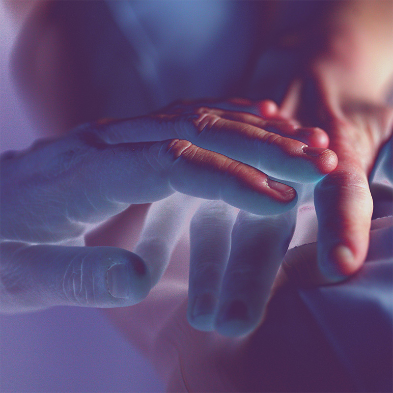 Hands being held over representing holistic reiki healing