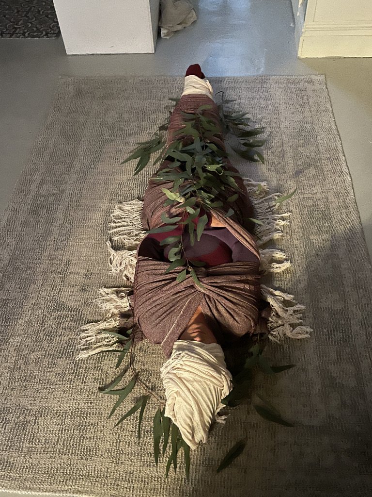 woman-wrapped-in-rebozos-on-floor